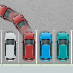 Czerwony samochód manewruje, próbując zaparkować. Wygląda na to, że nie umiem parkować, bo auto jest w dziwnej pozycji.